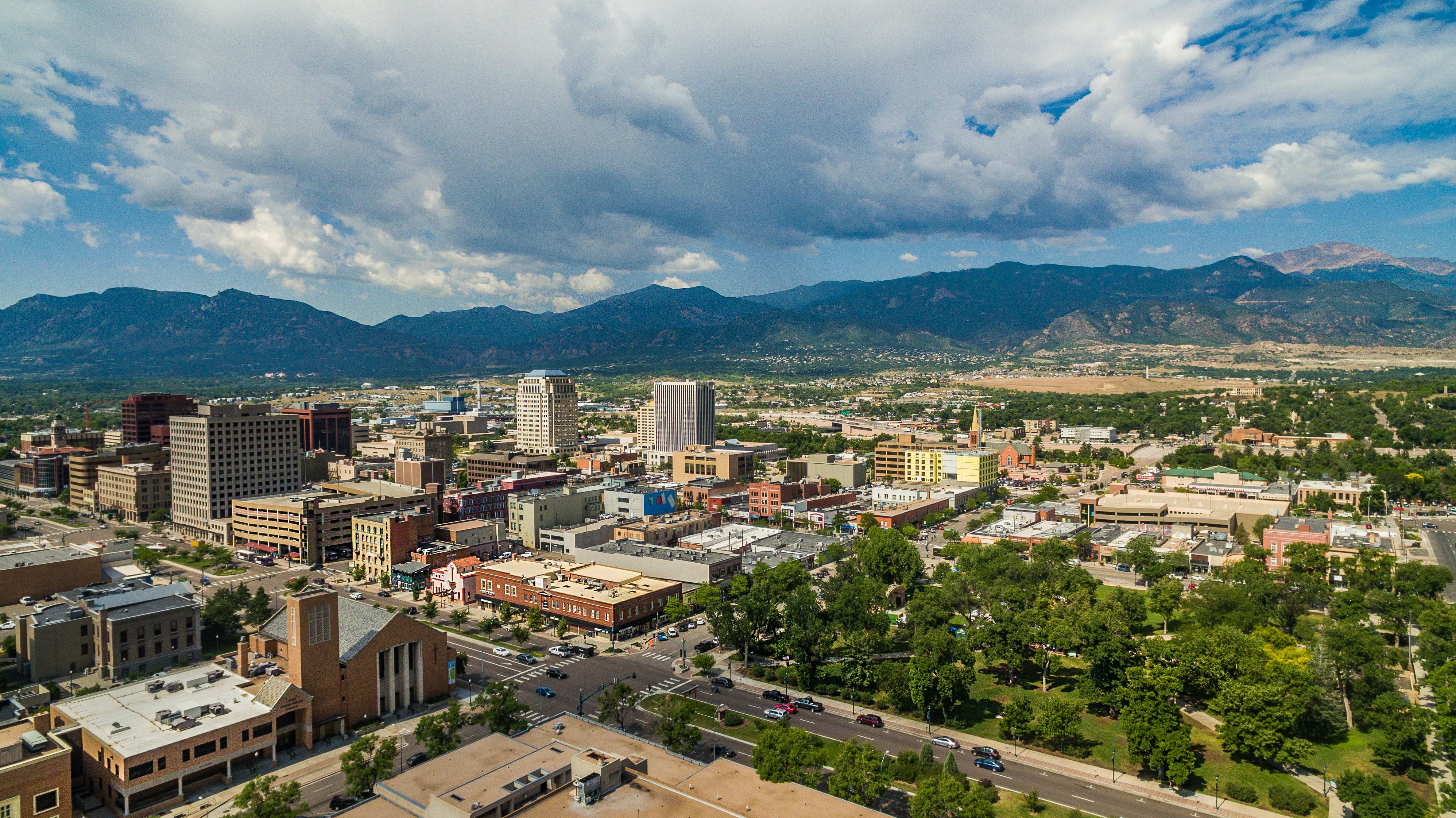 image of buildings in foreground with mountains in the background