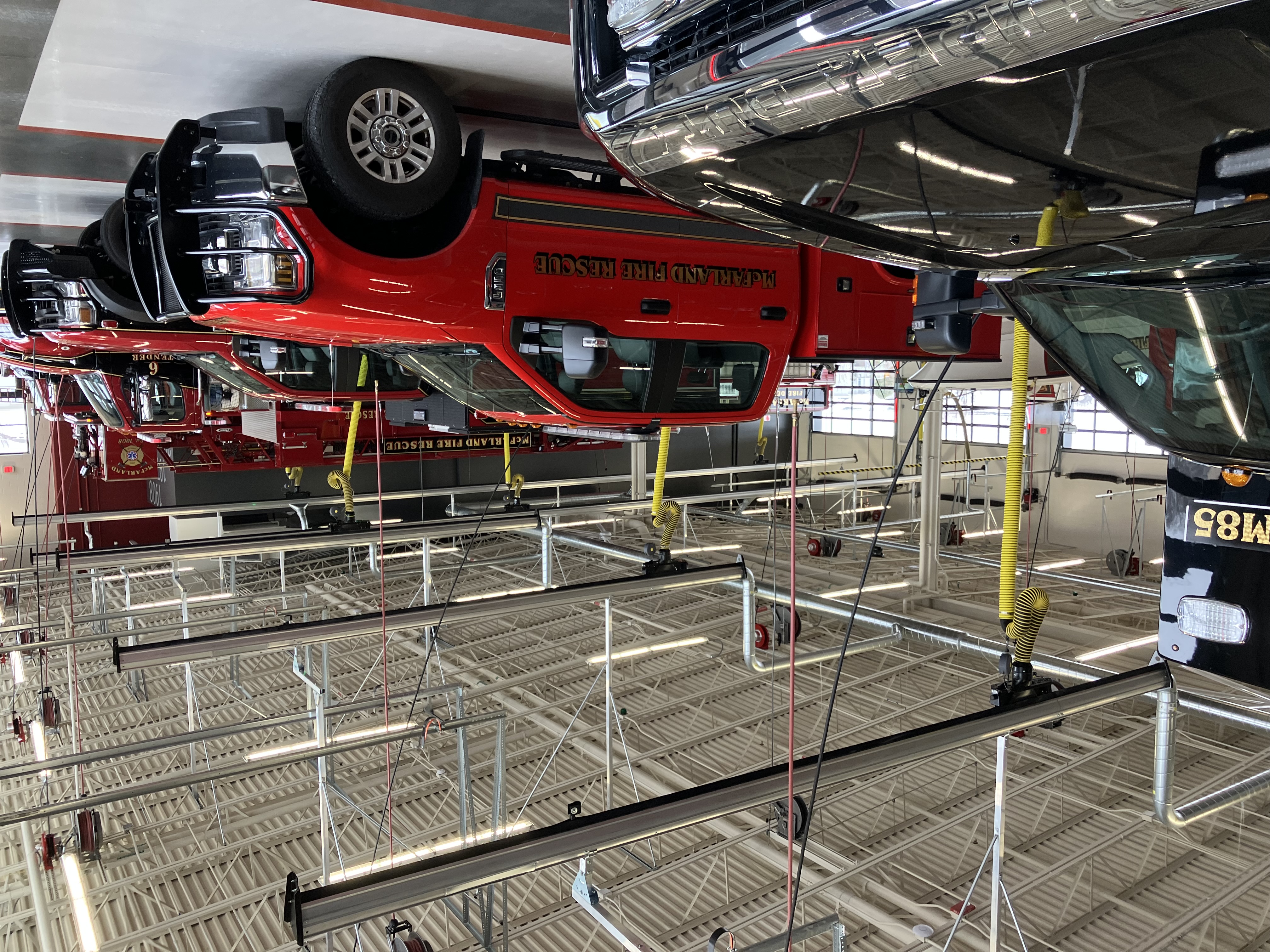 Fire rescue trucks in apparatus bay