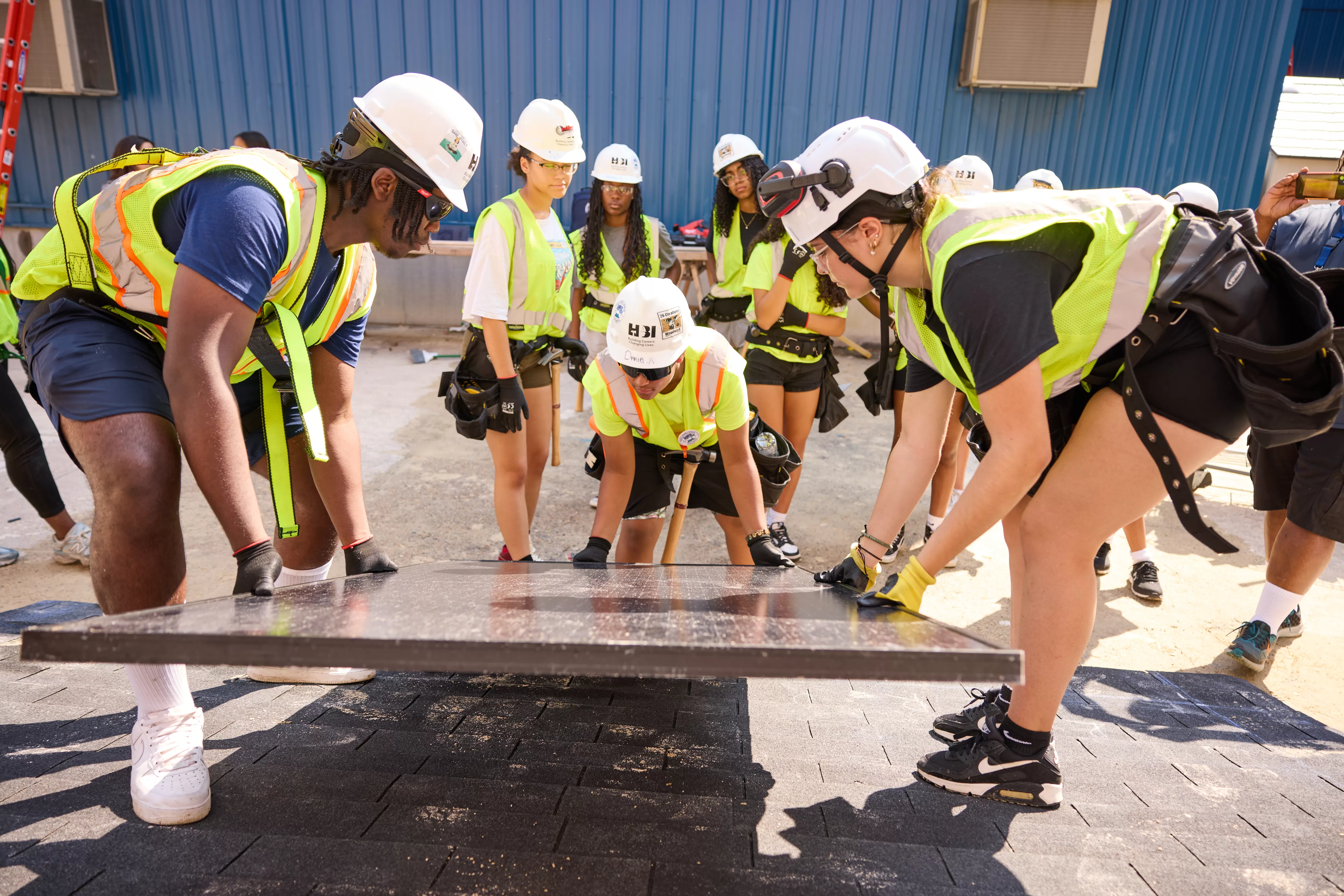 Middle school students learn about the solar and construction trades in a summer program