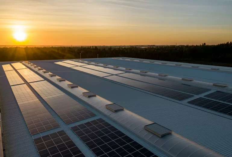 Solar Panels on Building with Sunrise